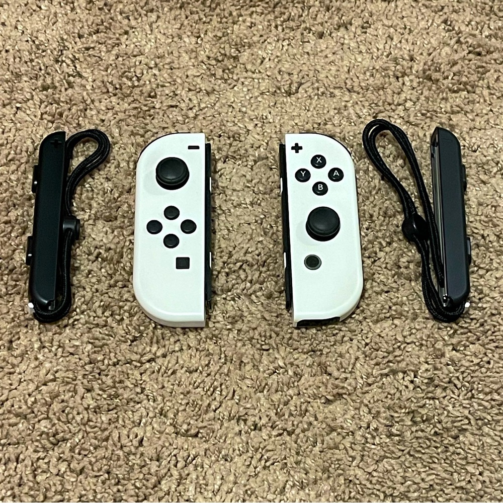 Nintendo Switch White OLED Joy-Cons with side straps